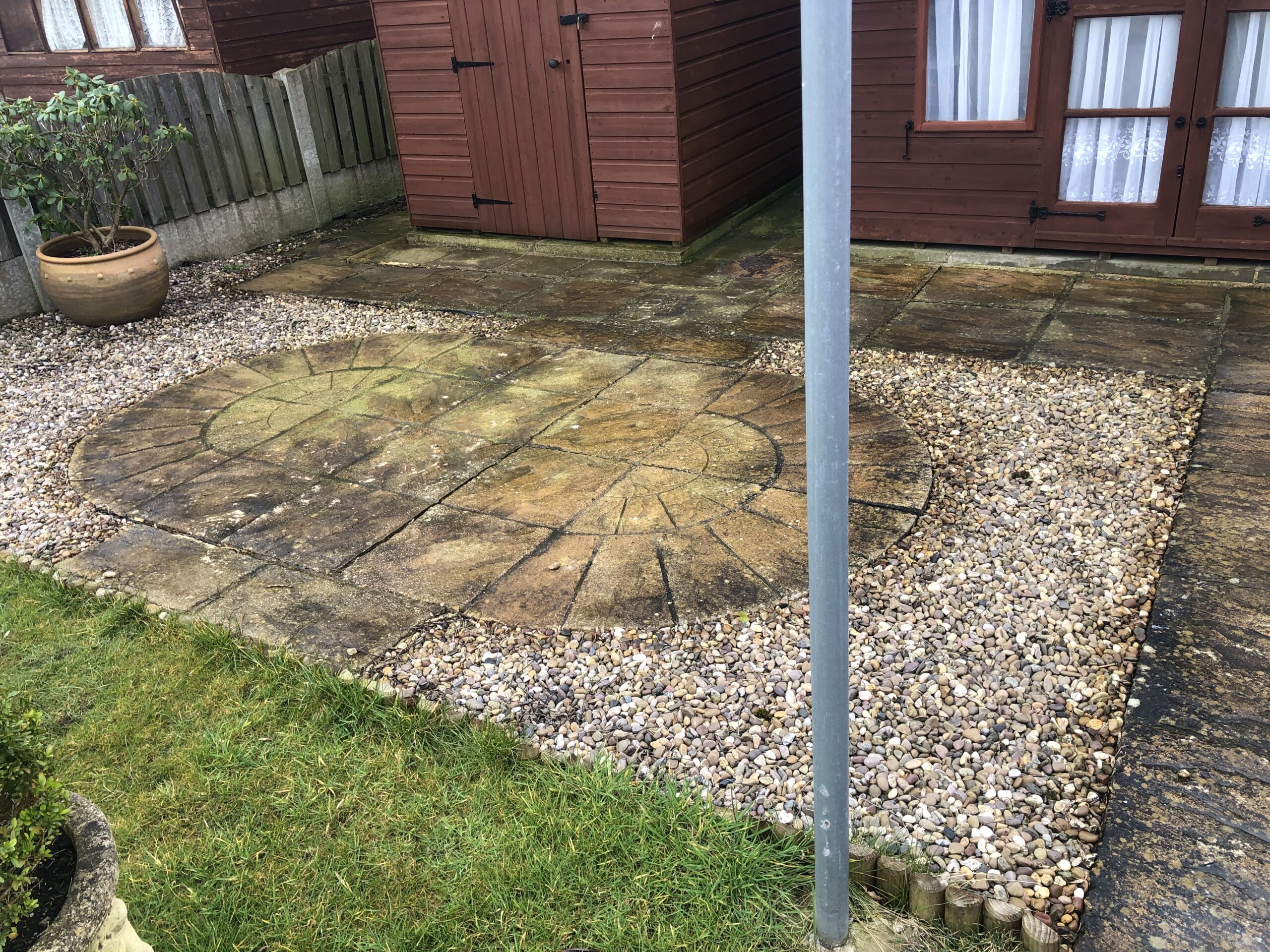 Patterned patio restoration before cleaning