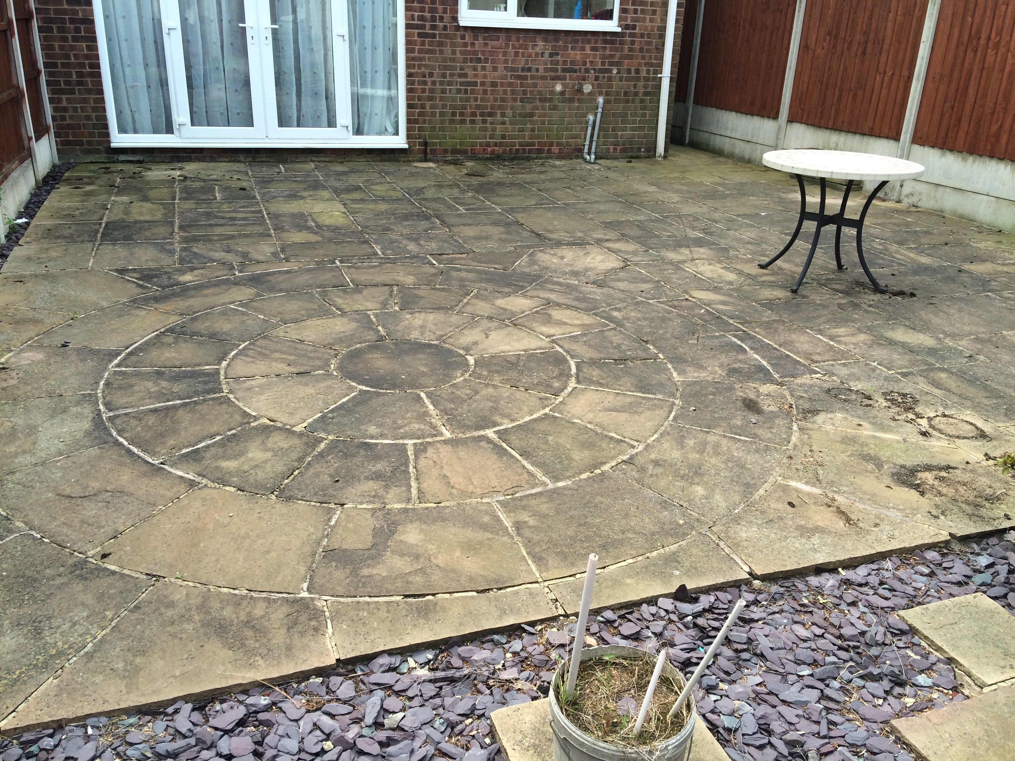 Patio pressure washing before cleaning